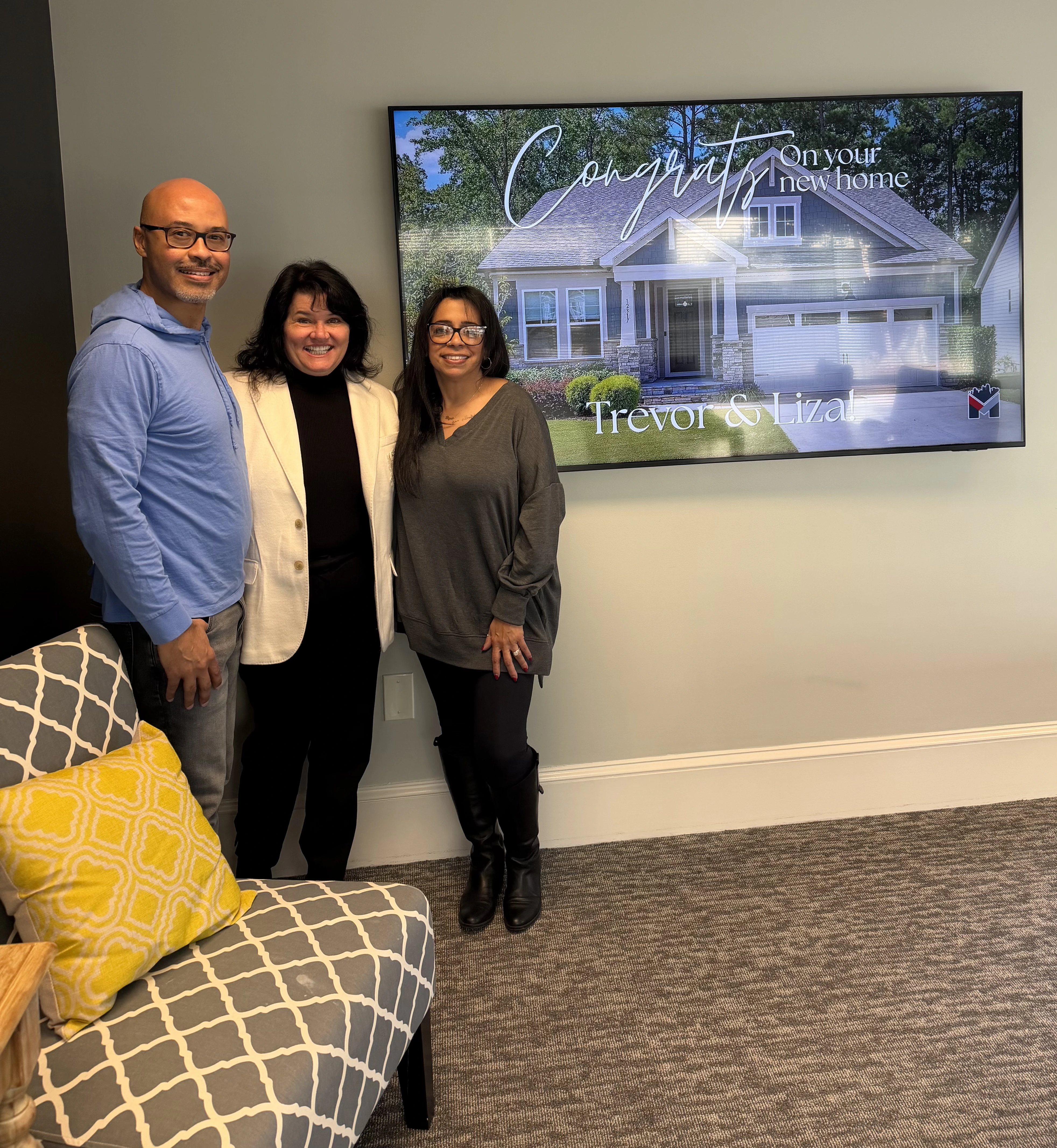 Gina Garver celebrating a successful real estate milestone with a client